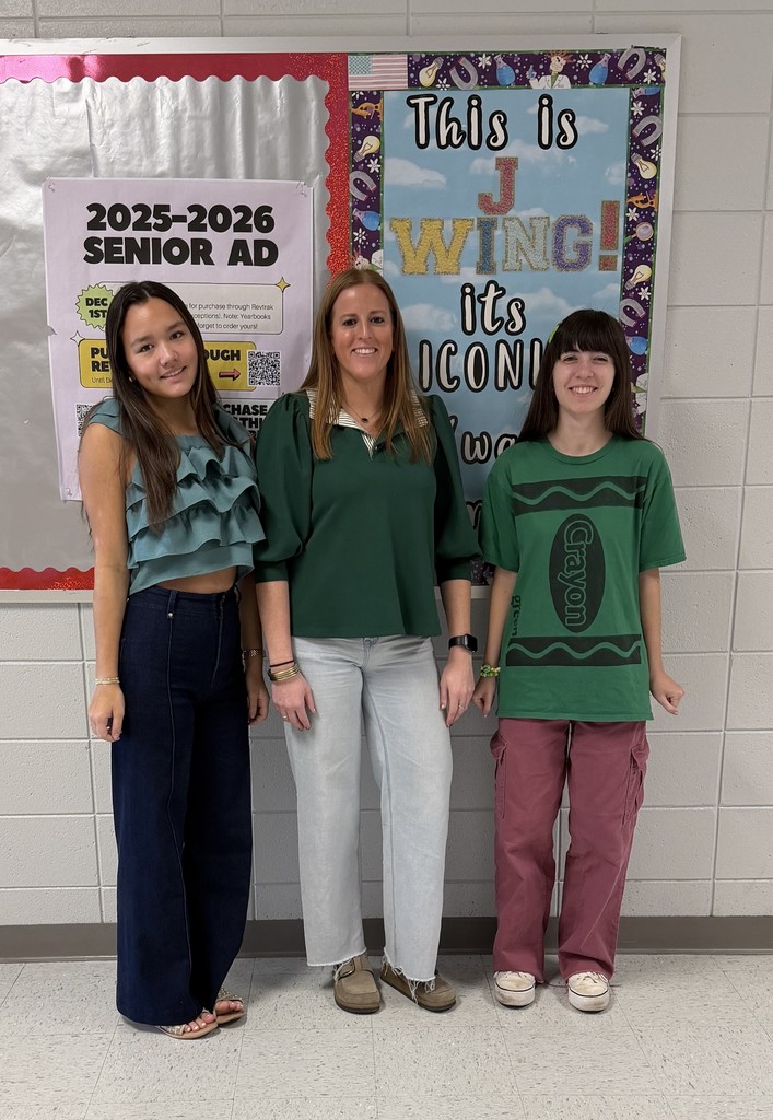 Teacher and two students wearing green