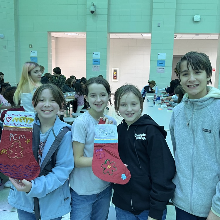 students decorating stockings
