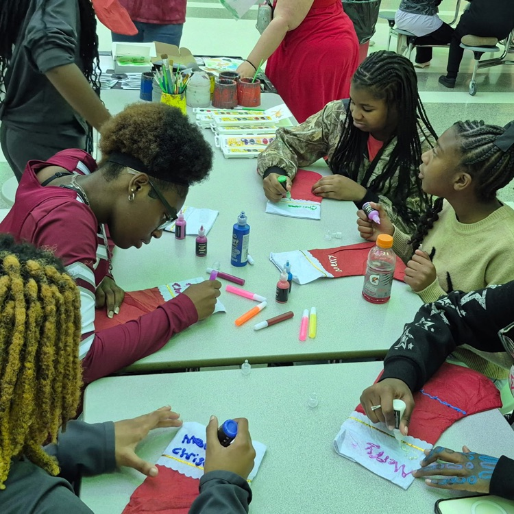 students decorating stockings