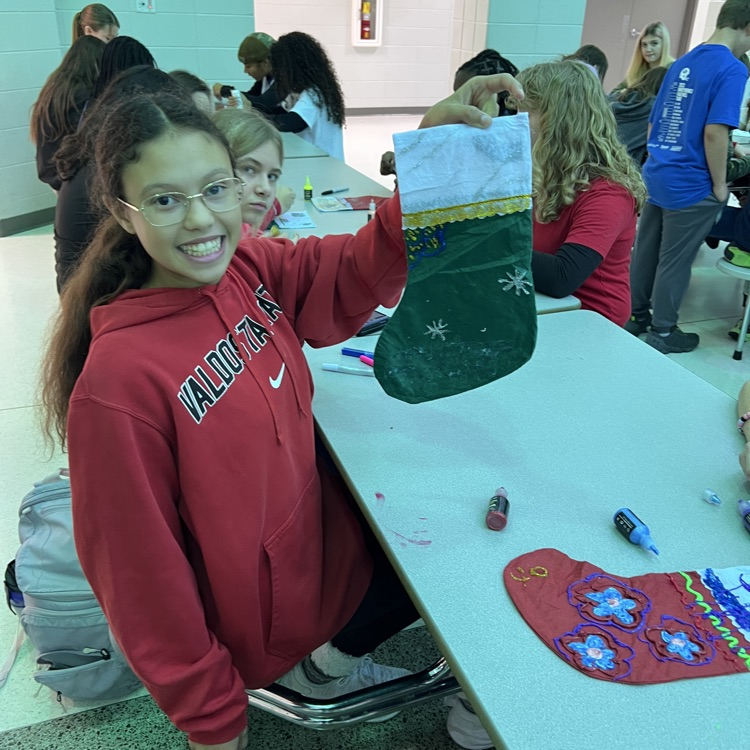 students decorating stockings