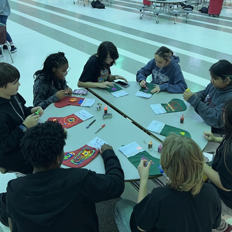 students decorating stockings