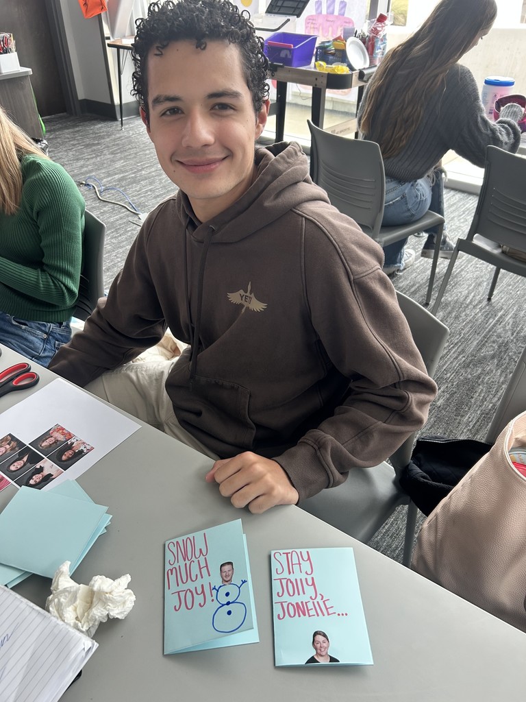 Yearbook staff member making cards for teachers
