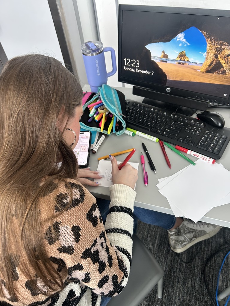 Yearbook staff member making a card
