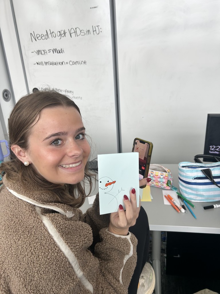 Yearbook staff member making a snowman card