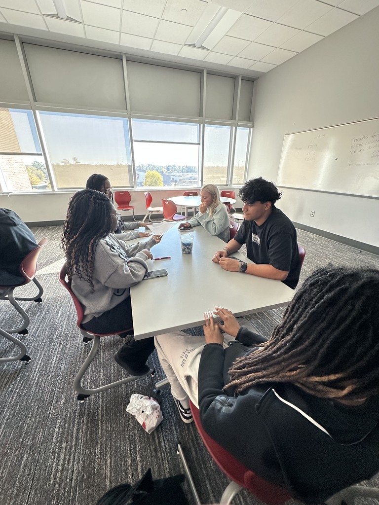 Students working together to gather data for a statistics project