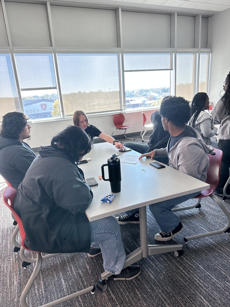 Students working together to gather data for a statistics project