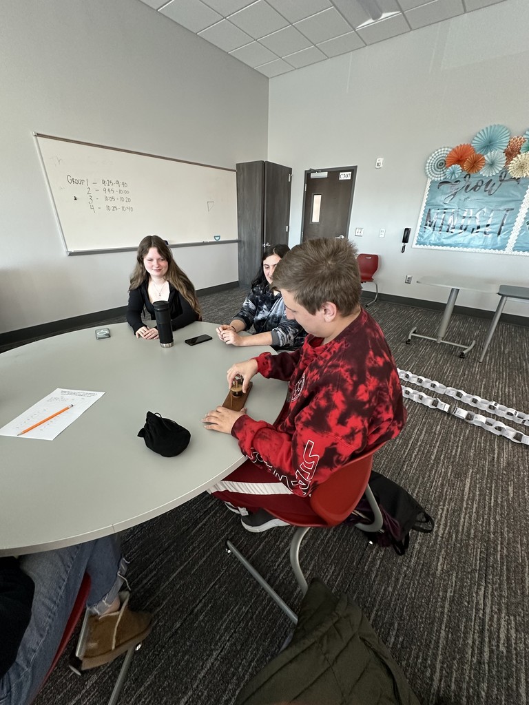 Students working together to gather data for a statistics project