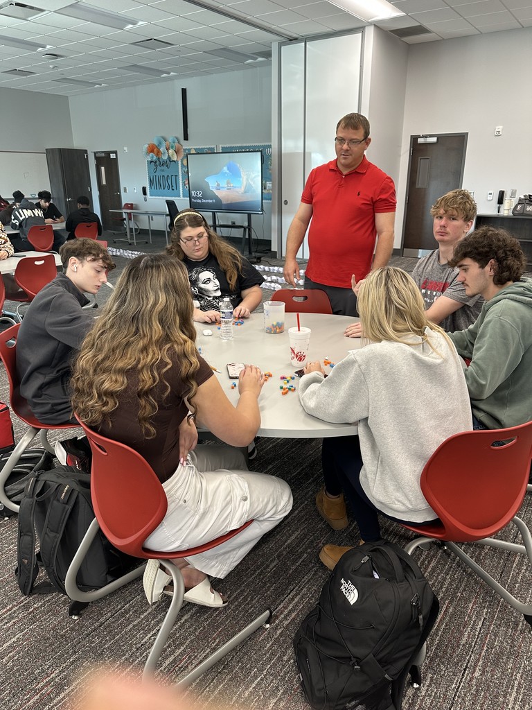 Mr. Wilson checking on a group of students