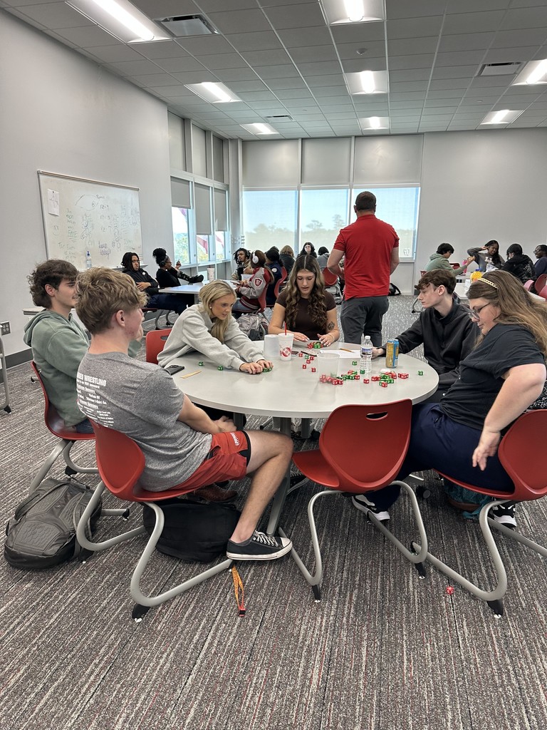 Students working together to gather data for a statistics project