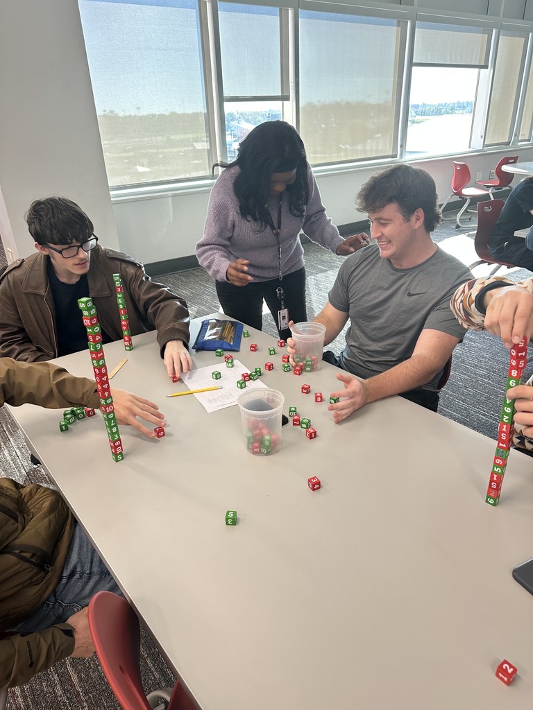 Ms. Harrison checking in on a group of students