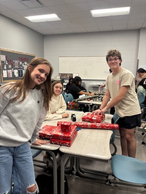 Students wrapping gifts