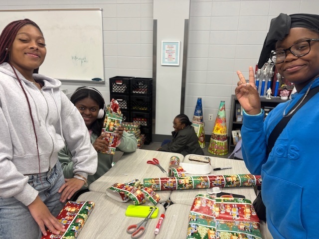 Students wrapping gifts
