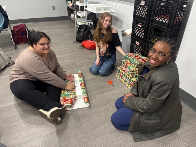 Students wrapping gifts
