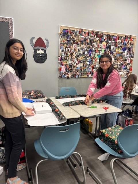 Students wrapping gifts
