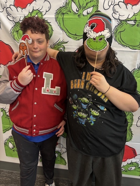 Students in front of Grinch background