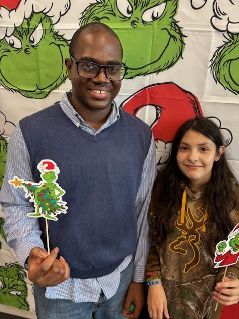 Students in front of Grinch background