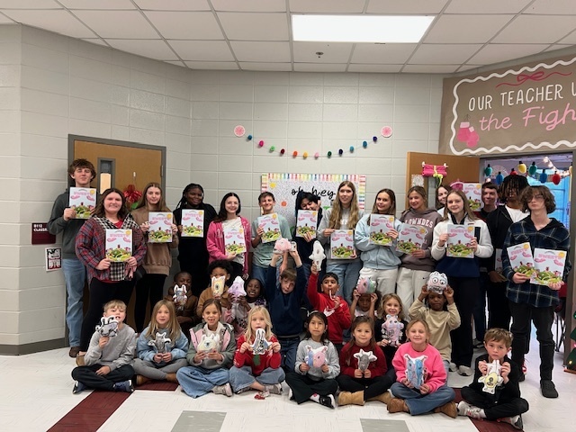 High school students with elementary students and their monsters