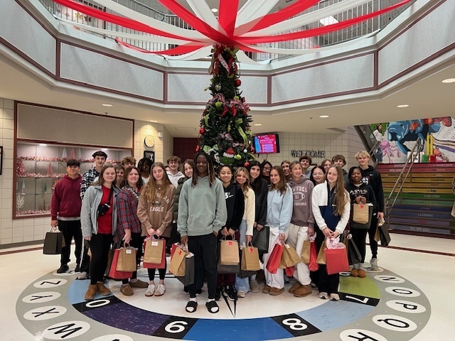 High school students ready to deliver the books and plushies
