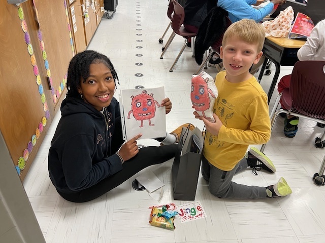 High school student and elementary student with original drawing and plushie