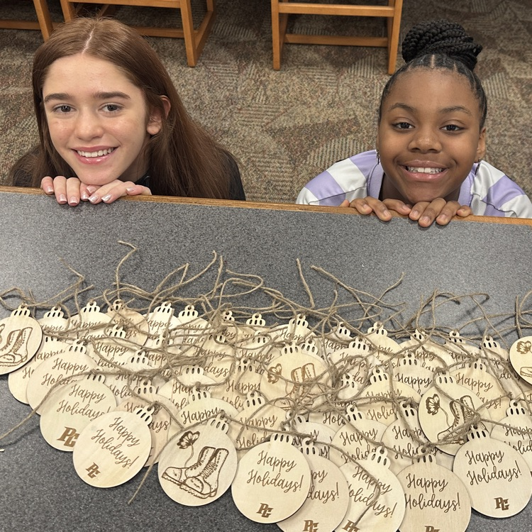 students posing with ornaments