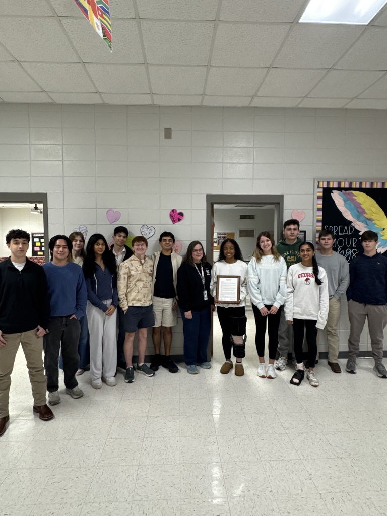 Large group of students with proclamation