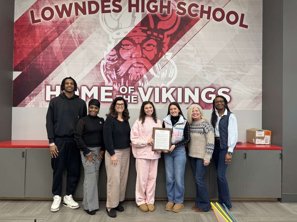 Office staff and student workers with proclamation