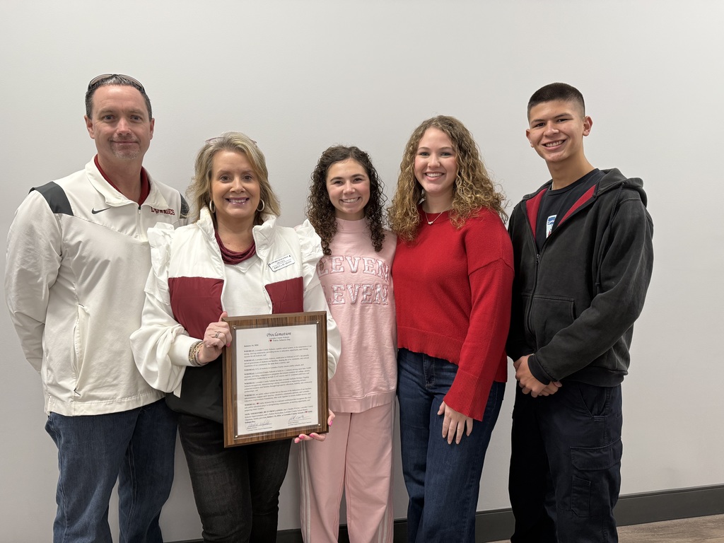 Athletic Director, Principal, and 3 students with proclamation