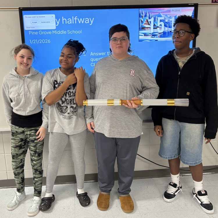 students holding Olympic torch