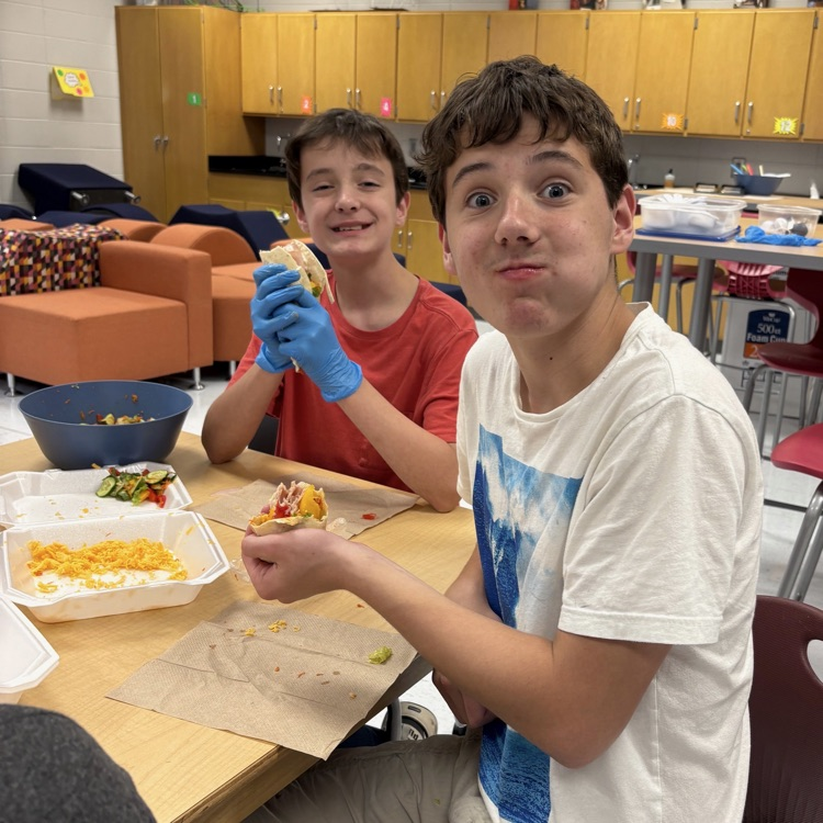 students enjoying food they made