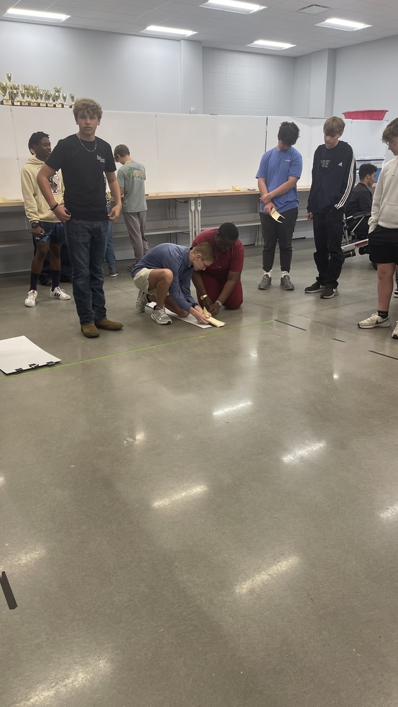 Students working together to builder gliders.