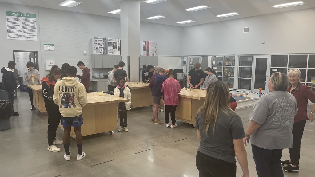 Students working together to builder gliders.