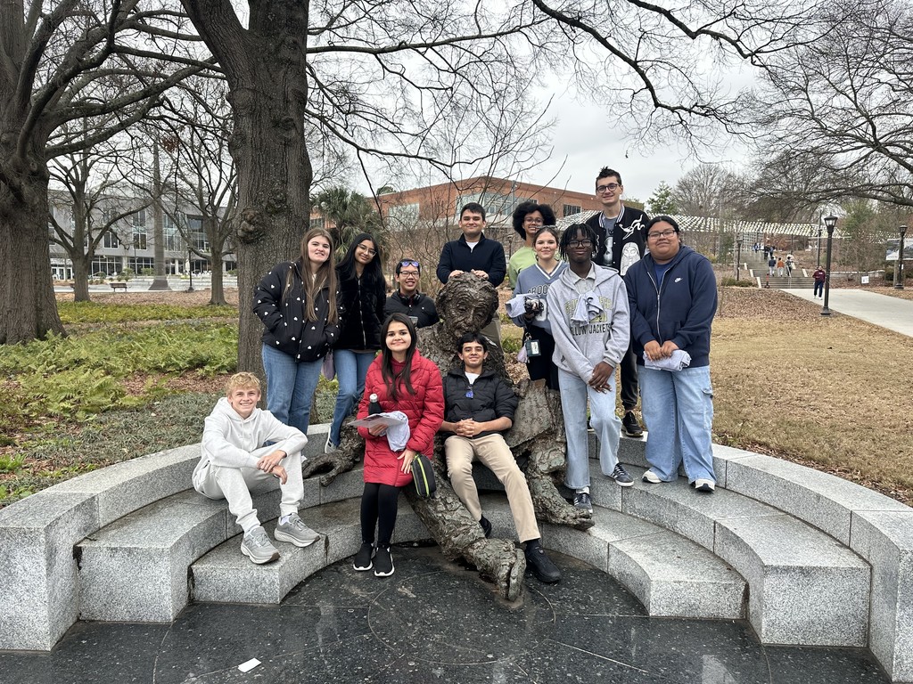 Students posing with statue at GA Tech