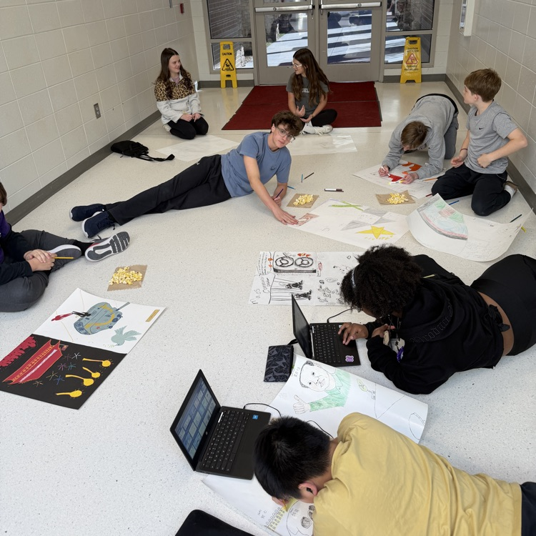 students working on posters