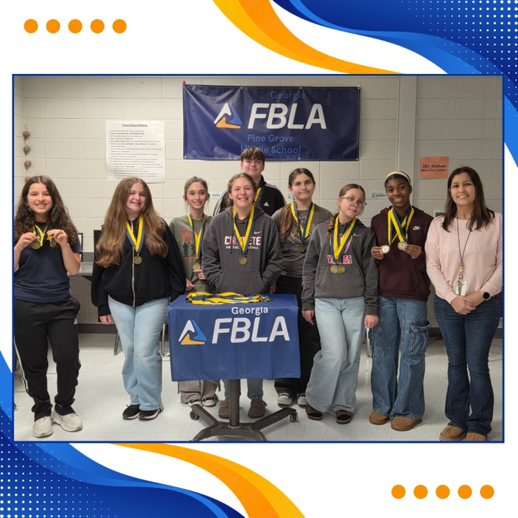 FBLA members posing with medals 
