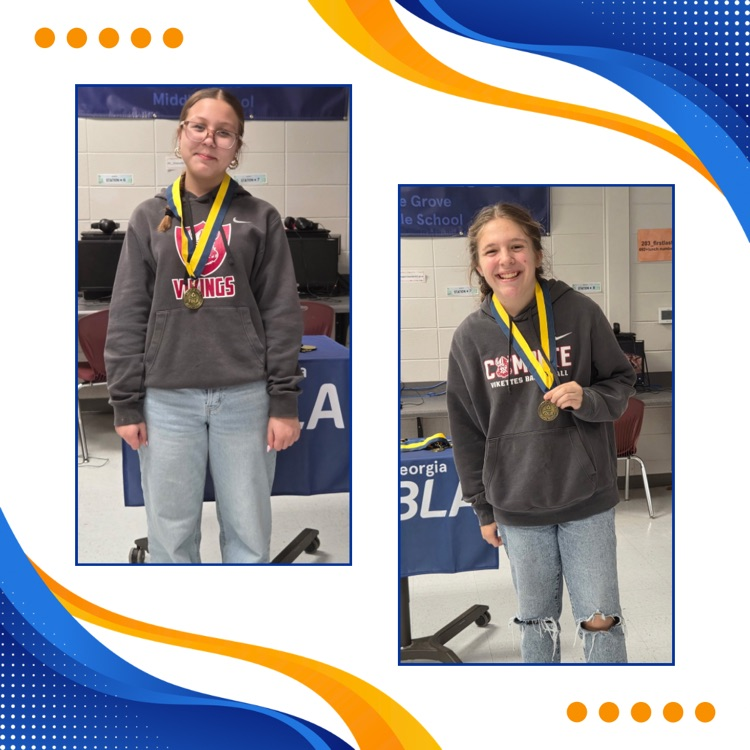 FBLA members posing with medals 