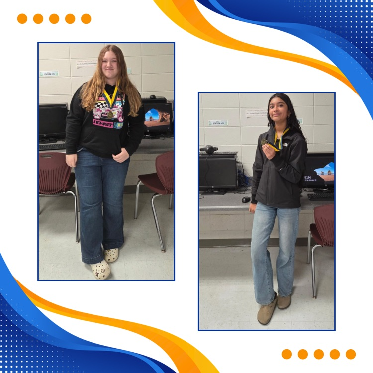 FBLA members posing with medals 