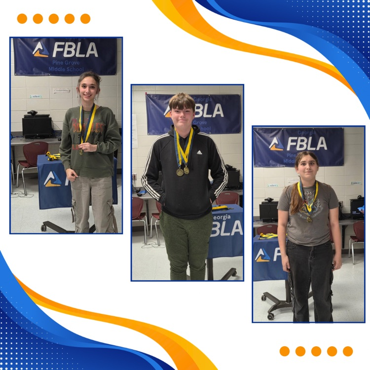 FBLA members posing with medals 