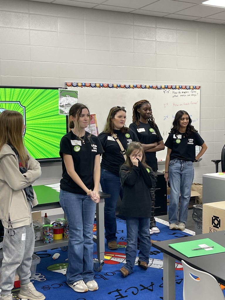 High school students with elementary students