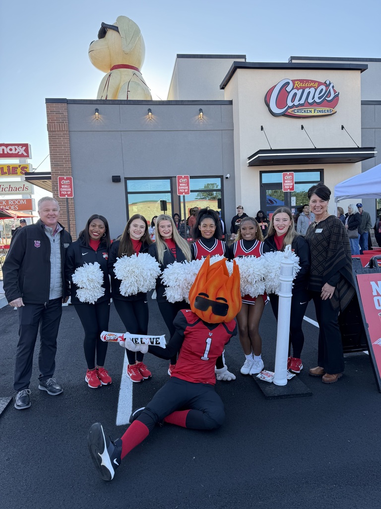 Assistant Principals Dickey and Hughes with the Valdosta Blazers at Raising Canes' Grand Opening