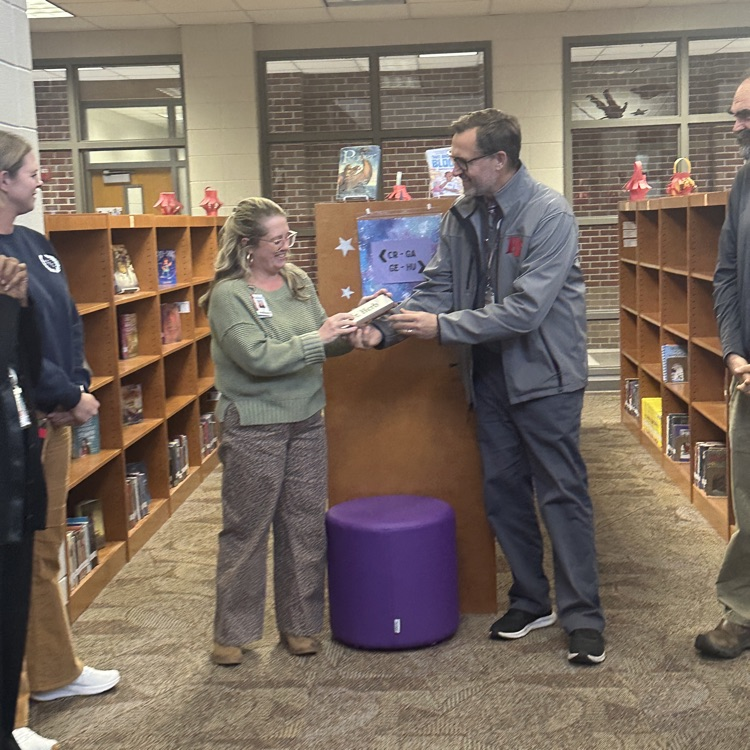 Mrs. Herb being presented a deskplate