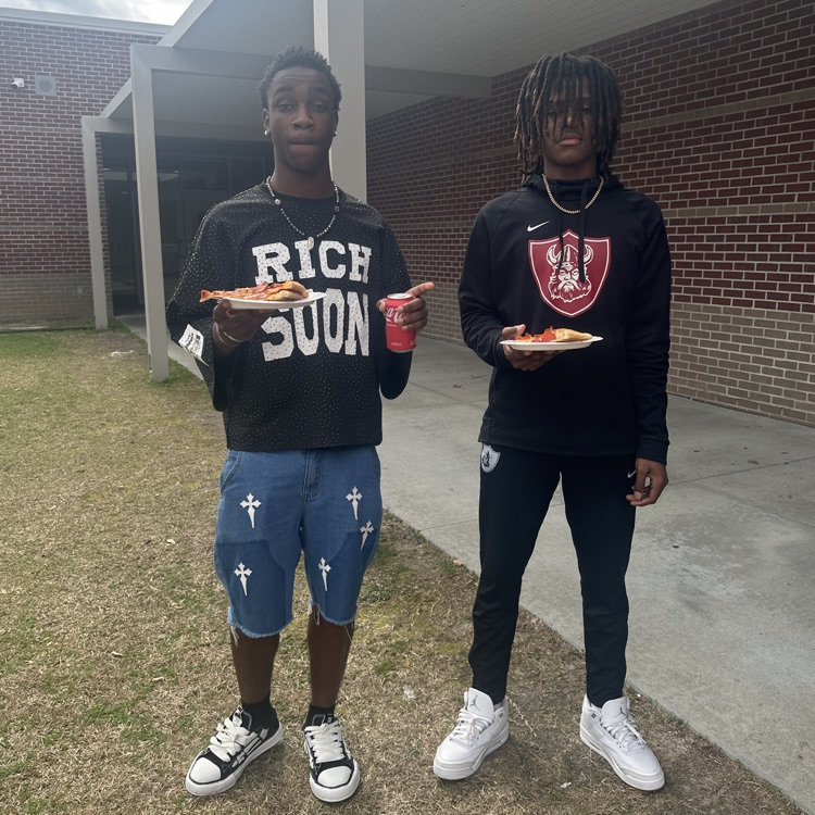 students posing with food 