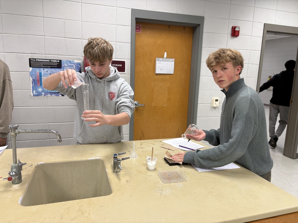 Students measuring and pouring