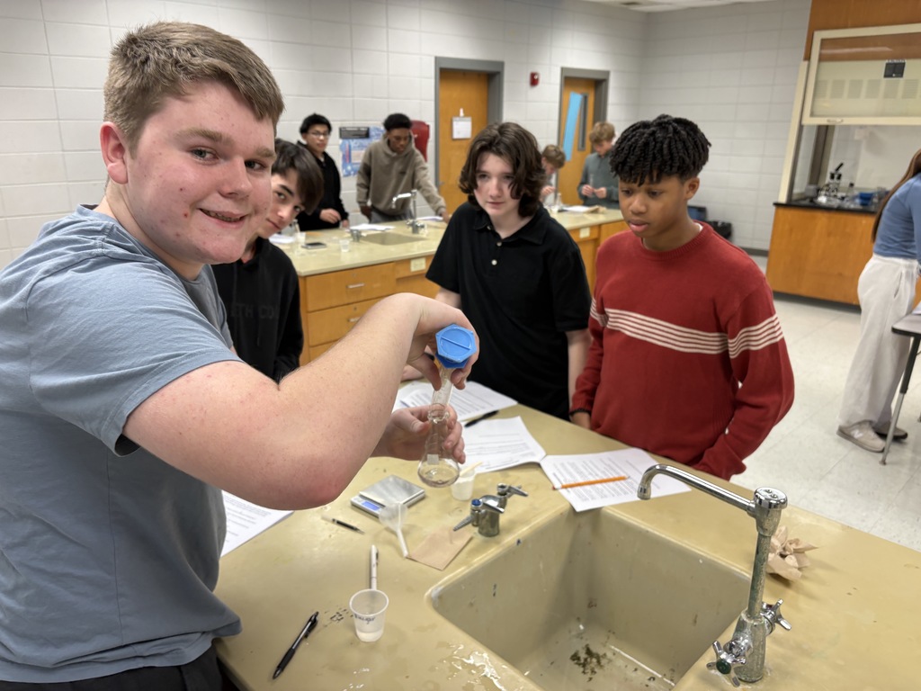 Students measuring and pouring