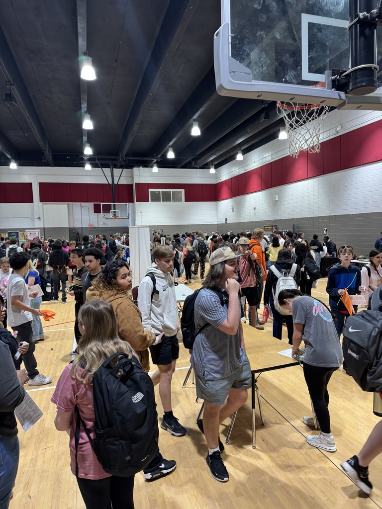 Students moving between tables at the Career Fair