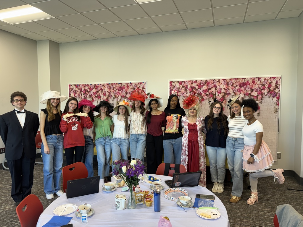 Mrs. Tuten with students at the Victorian Tea Party