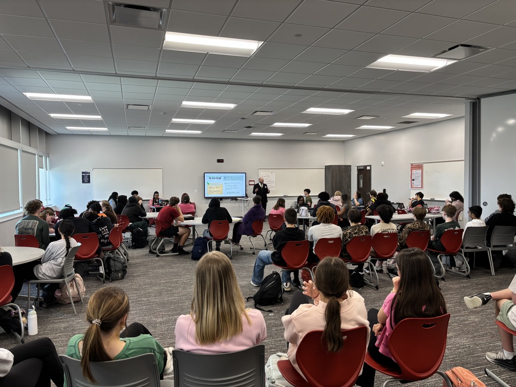 Mr. Collins speaking to the ELA students