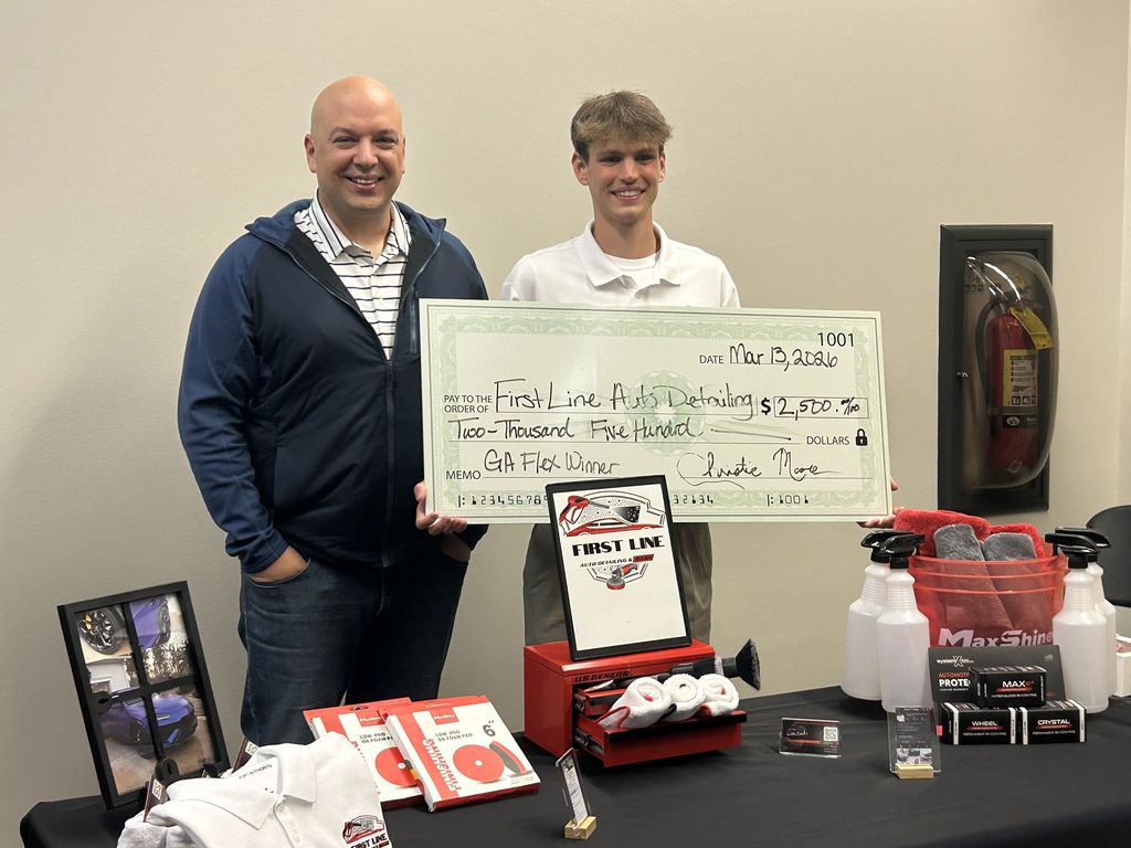 Landon with Mr. VanNus and his $2500 prize check