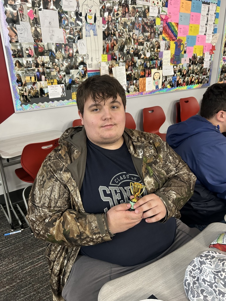 Student with small gold trophy