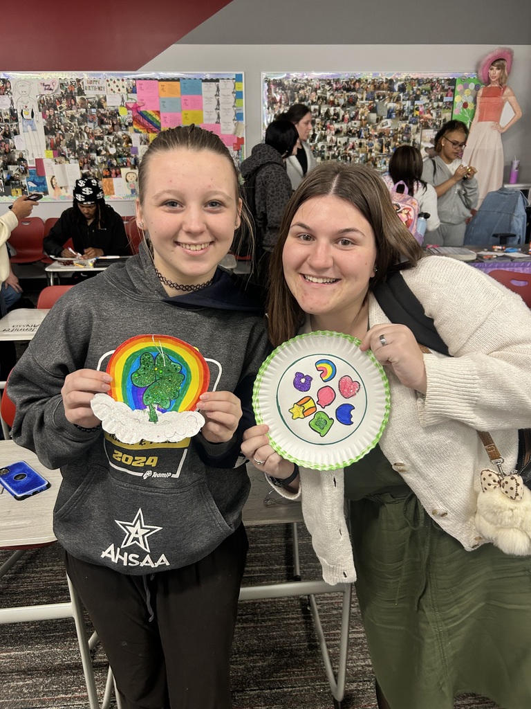 Students with artwork