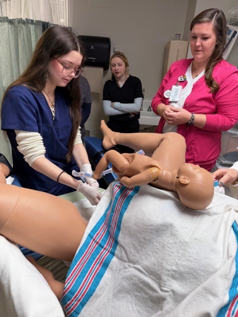 Allied health student participating in a simulation